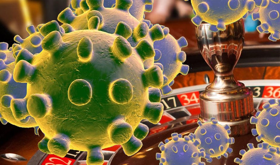 coronavirus en roulettetafel in het casino op de achtergrond